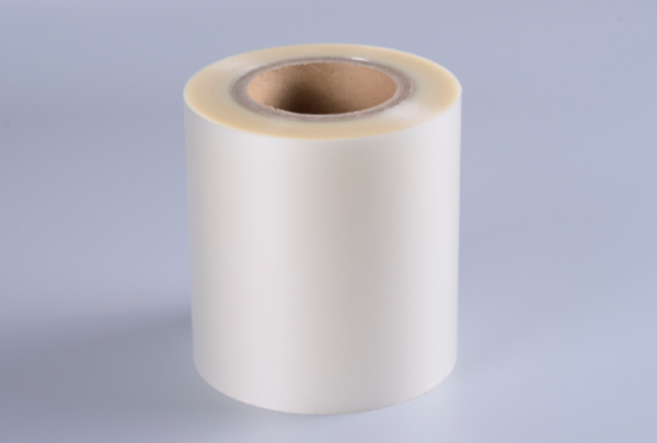 Washable and removable transparent film self-adhesive label on a beer bottle