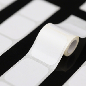 Removable thermal paper label cleanly peeled from plastic container with no residue