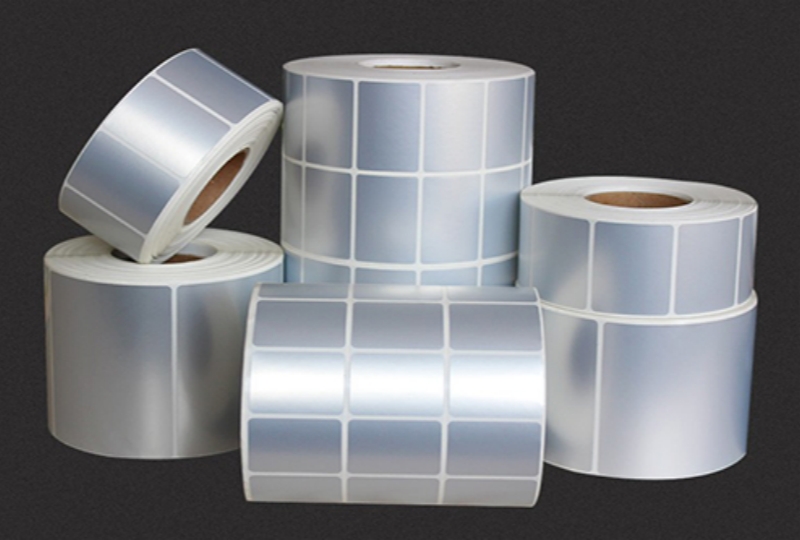 Matte silver PET inkjet labels applied on electronic device - durable, professional branding solution