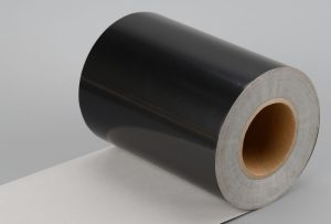 Close-up texture of a professional-grade matte black PET film, showing its smooth surface and consistent color.