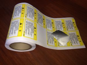 die-cut synthetic label sheet ready for application — custom synthetic label printing options