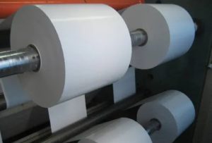 synthetic paper labels roll on printing press for custom synthetic label printing