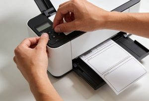 Printing a return address label test sheet from a desktop printer before large batch label production